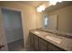 Bathroom with granite countertops and dual sinks at 7753 Hansel Ln, Lithonia, GA 30058