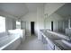 Large bathroom with granite countertops, soaker tub and glass shower at 7753 Hansel Ln, Lithonia, GA 30058