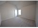 This bedroom features carpet, neutral paint and vaulted ceilings at 7753 Hansel Ln, Lithonia, GA 30058
