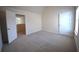 The carpeted bedroom has an en-suite entrance with an attached door at 7753 Hansel Ln, Lithonia, GA 30058