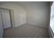 A bedroom featuring vaulted ceilings, carpet and closet at 7753 Hansel Ln, Lithonia, GA 30058