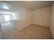 Neutral bonus room with neutral carpet, and natural light from the windows at 7753 Hansel Ln, Lithonia, GA 30058