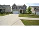 Charming two-story home with a well-manicured lawn and a large driveway at 7753 Hansel Ln, Lithonia, GA 30058