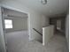 Bright hallway with neutral carpet leads to multiple rooms at 7753 Hansel Ln, Lithonia, GA 30058