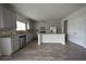 Modern kitchen featuring gray cabinets, stainless steel appliances, and center island at 7753 Hansel Ln, Lithonia, GA 30058