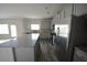 Spacious kitchen features stainless steel appliances, granite countertops, and ample cabinet space at 7753 Hansel Ln, Lithonia, GA 30058