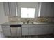 Kitchen with stainless steel appliances, granite countertops, and ample cabinet space at 7753 Hansel Ln, Lithonia, GA 30058
