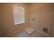 This laundry room features tile floors, shelving, and washer-dryer hookups at 7753 Hansel Ln, Lithonia, GA 30058