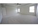 Large main bedroom with a ceiling fan, natural light from the windows at 7753 Hansel Ln, Lithonia, GA 30058