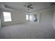 Spacious main bedroom with coffered ceiling and ensuite bathroom access at 7753 Hansel Ln, Lithonia, GA 30058