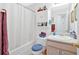Bathroom with shower/tub, updated vanity, and convenient storage at 144 Wiley Dr, Douglasville, GA 30134