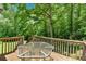 Enjoy nature with outdoor dining on the back deck, table included at 144 Wiley Dr, Douglasville, GA 30134