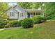 Charming single-story home with a covered front porch and well-maintained landscaping at 144 Wiley Dr, Douglasville, GA 30134