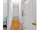 Hallway with neutral colors and access to bedrooms and storage at 144 Wiley Dr, Douglasville, GA 30134