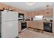 Functional kitchen features plenty of cabinet space, updated appliances, and ample counter area at 144 Wiley Dr, Douglasville, GA 30134