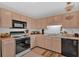 Well-lit kitchen features neutral cabinets, modern appliances, and efficient use of space at 144 Wiley Dr, Douglasville, GA 30134