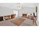 Bright living room features vaulted ceilings, brick fireplace and view of dining area at 144 Wiley Dr, Douglasville, GA 30134