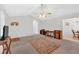 Living room with fireplace, neutral walls, view of hall, and small dining area at 144 Wiley Dr, Douglasville, GA 30134