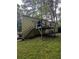 Exterior view of a house featuring a backyard with a wooden deck and stairs at 1750 Beechwood Sw Blvd, Atlanta, GA 30311