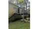 Exterior view of a house featuring a backyard with a wooden deck and stairs at 1750 Beechwood Sw Blvd, Atlanta, GA 30311