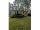 Exterior view of a house featuring a backyard with a wooden deck and stairs at 1750 Beechwood Sw Blvd, Atlanta, GA 30311