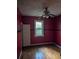 A bedroom featuring hardwood floors, a ceiling fan, and a window with natural light at 1750 Beechwood Sw Blvd, Atlanta, GA 30311