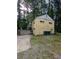 Side view of home with driveway, garage, and exterior door at 1750 Beechwood Sw Blvd, Atlanta, GA 30311