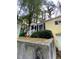 Charming one-story home featuring yellow exterior, dark shutters, and a welcoming front entrance at 1750 Beechwood Sw Blvd, Atlanta, GA 30311