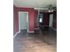 Open living room with hardwood floors, two doorways, and a ceiling fan at 1750 Beechwood Sw Blvd, Atlanta, GA 30311