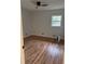 Bedroom with hardwood floors, a ceiling fan, and a window for natural light at 2037 Brannen Se Rd, Atlanta, GA 30316