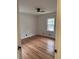 Bedroom with hardwood floors, a ceiling fan, and a window for natural light at 2037 Brannen Se Rd, Atlanta, GA 30316