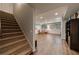 Finished basement with stairs, wood-look floors, and recessed lighting at 4115 Falls Ridge Dr, Johns Creek, GA 30022