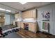 Finished basement with craft cabinets, desk, and a mirrored workout area at 4115 Falls Ridge Dr, Johns Creek, GA 30022
