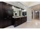 Bathroom with double sink vanity, lots of storage and dark cabinets at 4115 Falls Ridge Dr, Johns Creek, GA 30022