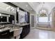 Spacious bathroom with granite counters, soaking tub, and separate vanity at 4115 Falls Ridge Dr, Johns Creek, GA 30022