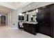Bathroom with double sinks, make up vanity, and dark cabinets and lots of storage at 4115 Falls Ridge Dr, Johns Creek, GA 30022