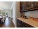 Dining area with built in cabinetry and view to large table with seating for eight at 4115 Falls Ridge Dr, Johns Creek, GA 30022