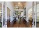 Elegant foyer featuring high ceilings, hardwood floors, and a grand staircase at 4115 Falls Ridge Dr, Johns Creek, GA 30022