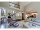 Welcoming foyer leading to a living room with a fireplace and an open layout to the kitchen at 4115 Falls Ridge Dr, Johns Creek, GA 30022