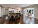 Open-concept kitchen with a center island, stainless steel appliances, and adjacent breakfast nook with views of the backyard at 4115 Falls Ridge Dr, Johns Creek, GA 30022