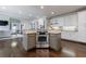 Open kitchen design with a center island cooktop, granite countertops, and ample cabinet space at 4115 Falls Ridge Dr, Johns Creek, GA 30022