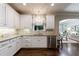 Well-lit kitchen with granite countertops, stainless steel appliances, and a view into the breakfast nook at 4115 Falls Ridge Dr, Johns Creek, GA 30022