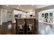 A stylish kitchen featuring an island with bar seating and stainless steel appliances at 4115 Falls Ridge Dr, Johns Creek, GA 30022
