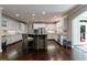 A spacious kitchen with a large island, stainless steel appliances, and hardwood floors at 4115 Falls Ridge Dr, Johns Creek, GA 30022