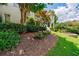 Landscaping detail featuring mulch, rose bushes and manicured hedges at 4115 Falls Ridge Dr, Johns Creek, GA 30022