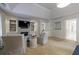 Open living room featuring a fireplace, custom built-ins, and sitting area at 4115 Falls Ridge Dr, Johns Creek, GA 30022