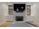 Comfortable living room featuring a fireplace, custom built-ins, and lots of space at 4115 Falls Ridge Dr, Johns Creek, GA 30022