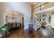 Open concept living space featuring dark hardwood floors and a view of a living room at 4115 Falls Ridge Dr, Johns Creek, GA 30022