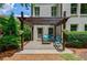 Covered patio with a pergola, adorned with string lights, and comfortable seating for relaxing outdoor gatherings at 4115 Falls Ridge Dr, Johns Creek, GA 30022