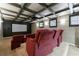 Movie room with a projector and theater seating at 4115 Falls Ridge Dr, Johns Creek, GA 30022